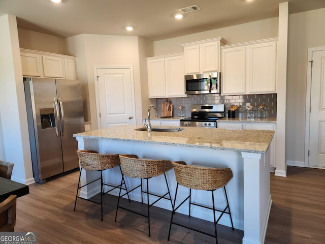 28 Russet Way Lot 60, Newnan, GA 30263 - kitchen with stainless steel appliances, a sink, dark wood-style floors, white cabinetry, and recessed lighting