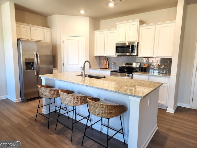28 Russet Way Lot 60, Newnan, GA 30263 - kitchen featuring appliances with stainless steel finishes, a sink, baseboards, dark wood-type flooring, and recessed lighting