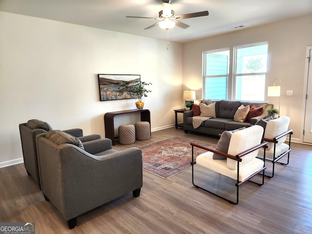 28 Russet Way Lot 60, Newnan, GA 30263 - living room featuring wood finished floors, a ceiling fan, and baseboards