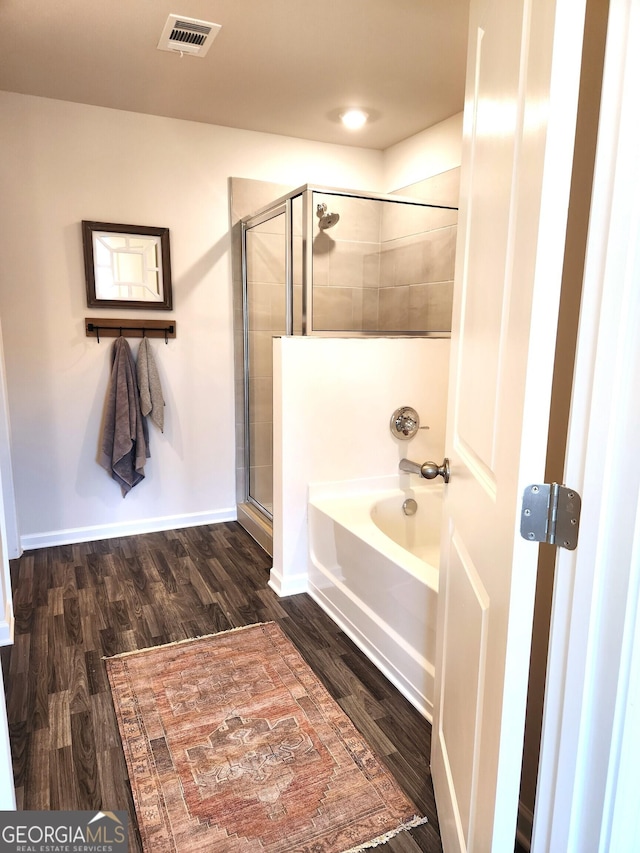 28 Russet Way Lot 60, Newnan, GA 30263 - bathroom with an enclosed shower, a bathtub, wood finished floors, and baseboards