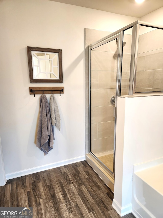 28 Russet Way Lot 60, Newnan, GA 30263 - bathroom featuring a shower stall, wood finished floors, and baseboards