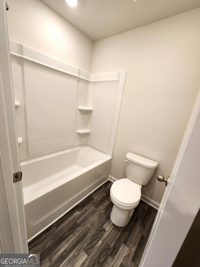 28 Russet Way Lot 60, Newnan, GA 30263 - bathroom with wood finished floors, toilet, baseboards, and tub / shower combination