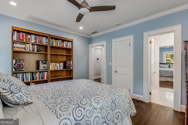 bedroom featuring ceiling fan, dark wood-type flooring, and ornamental molding