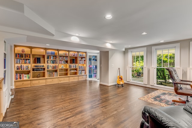 interior space featuring dark wood-type flooring and built in features