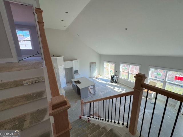 stairs with vaulted ceiling