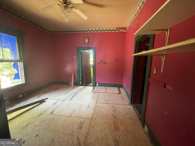 unfurnished room featuring ceiling fan