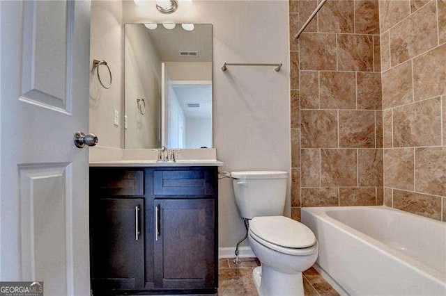 full bathroom featuring toilet, vanity, and tiled shower / bath combo