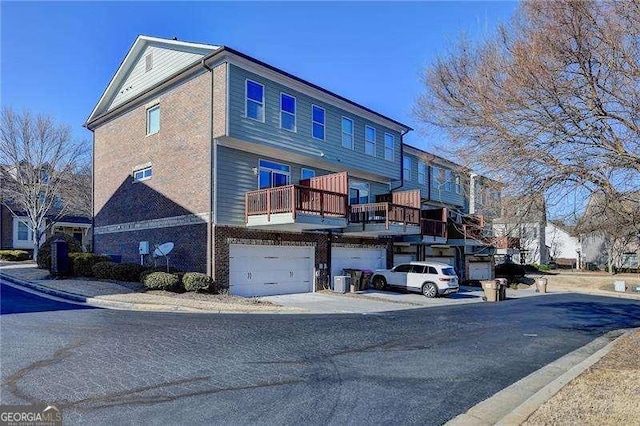 exterior space with a balcony and a garage