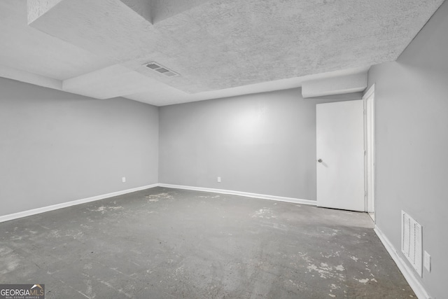 empty room with a textured ceiling