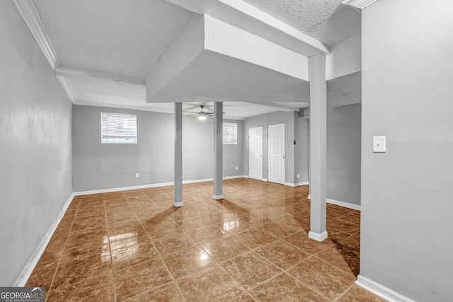 basement with tile patterned floors and ceiling fan