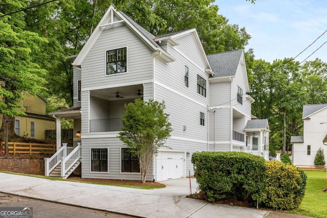 view of front of home featuring a balcony and a garage