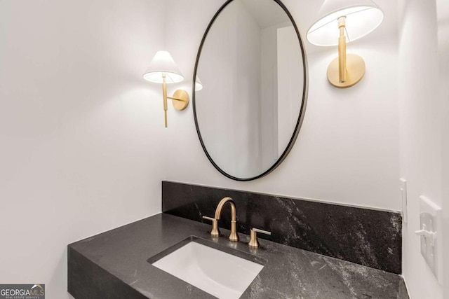 bathroom with backsplash and vanity