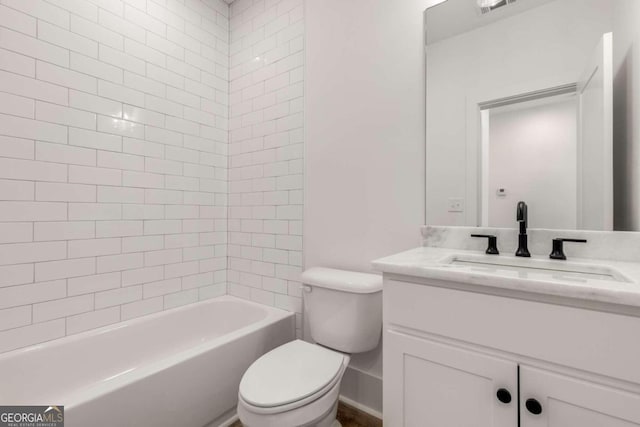 full bathroom with toilet, vanity, and tiled shower / bath combo