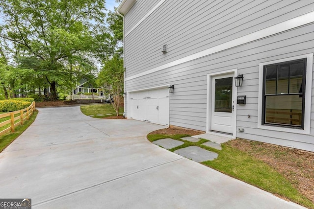 view of property exterior featuring a garage