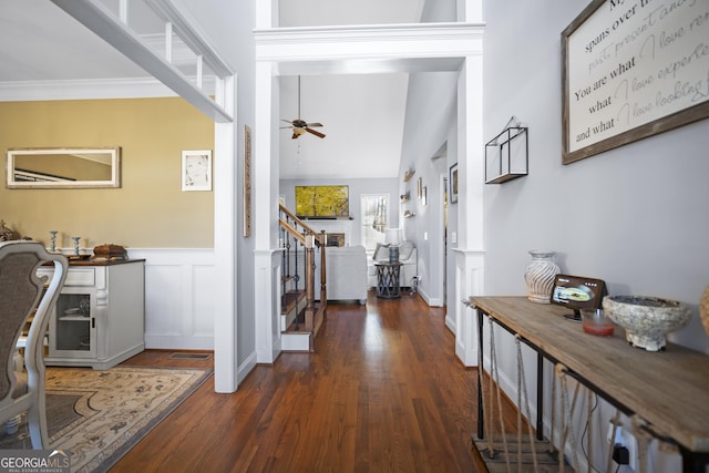 hallway featuring ornamental molding and dark hardwood / wood-style floors