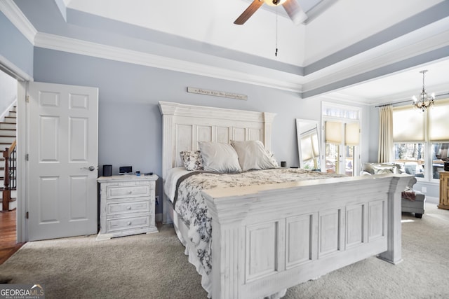 carpeted bedroom featuring crown molding, a raised ceiling, and ceiling fan with notable chandelier