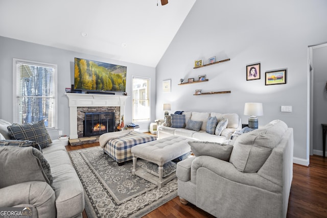 living room featuring a fireplace, high vaulted ceiling, and dark hardwood / wood-style floors