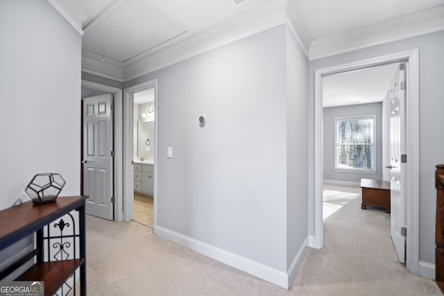 hall featuring crown molding and light carpet