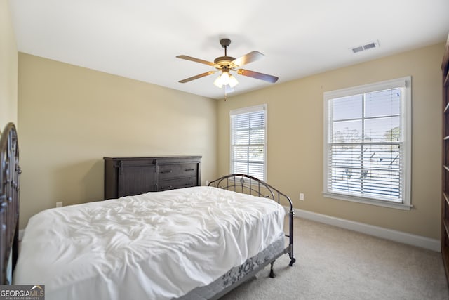 carpeted bedroom with ceiling fan