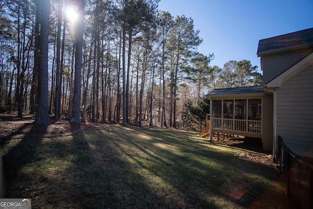 view of yard featuring a sunroom