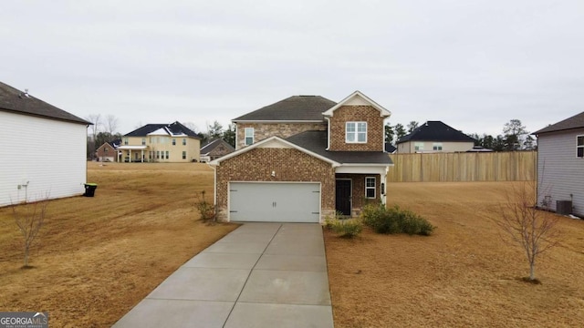 view of front of home featuring central AC unit, a front yard, and a garage