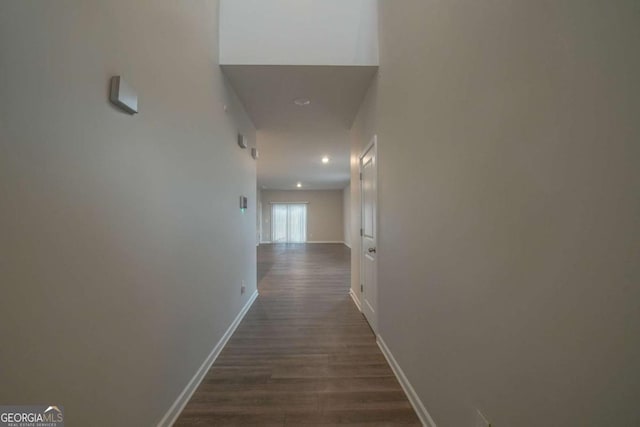 corridor with dark wood-type flooring