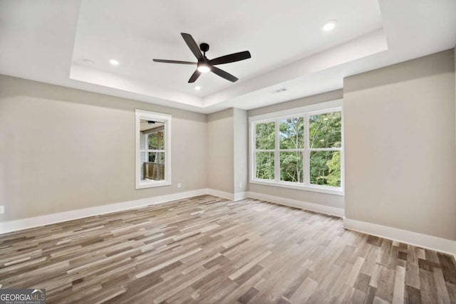 220 Autumn Brook Dr, Canton, GA 30115 - spare room featuring a raised ceiling, wood finished floors, ceiling fan, and recessed lighting