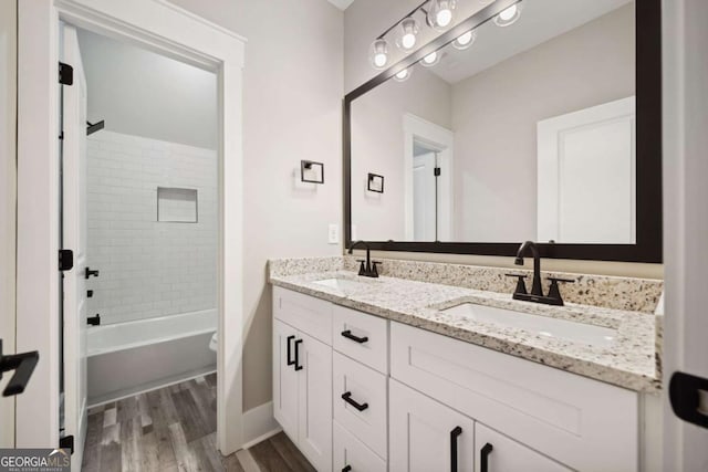 220 Autumn Brook Dr, Canton, GA 30115 - full bath with double vanity, wood finished floors, and shower / bathtub combination