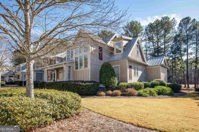 view of side of home with a lawn