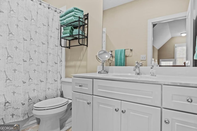 bathroom featuring toilet, vanity, lofted ceiling, and a shower with shower curtain