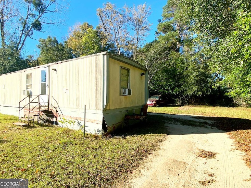 view of home's exterior featuring a lawn