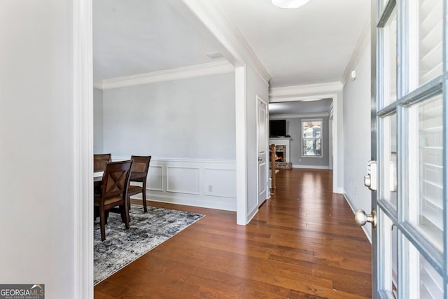 entrance foyer featuring dark hardwood / wood-style flooring and ornamental molding