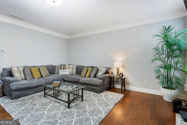 living room with ornamental molding and dark hardwood / wood-style floors