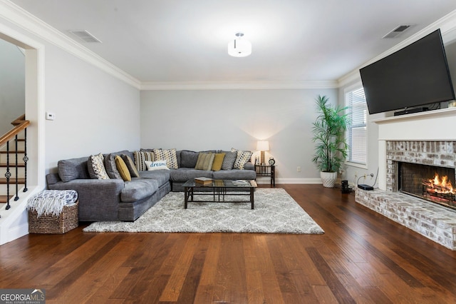 living room featuring a fireplace, dark hardwood / wood-style floors, and crown molding