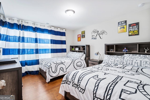 bedroom featuring hardwood / wood-style floors