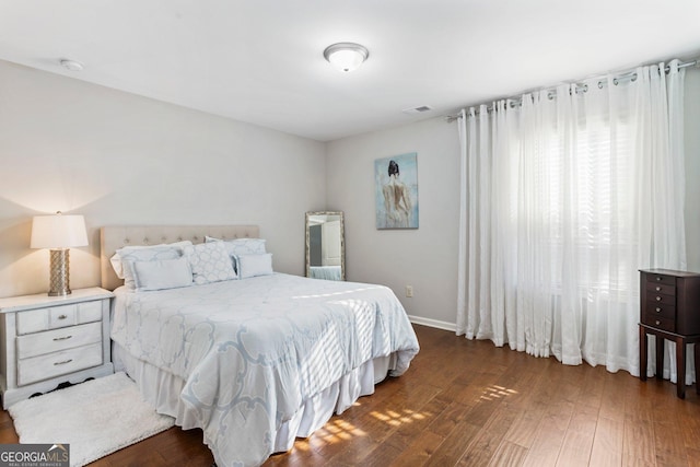 bedroom featuring dark wood-type flooring