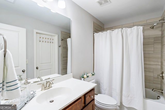 full bathroom featuring toilet, shower / bathtub combination with curtain, and vanity