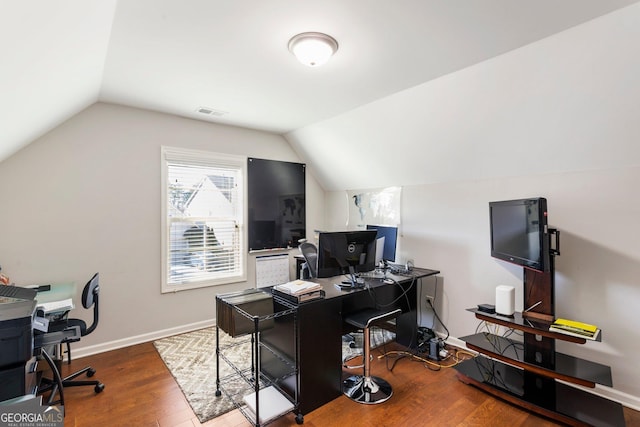 home office featuring vaulted ceiling and hardwood / wood-style floors