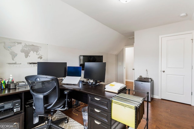 office area with dark hardwood / wood-style floors and vaulted ceiling