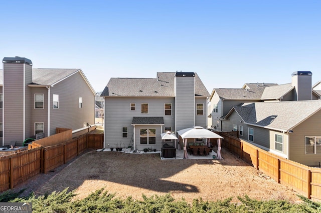 rear view of house with a patio