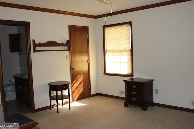 carpeted bedroom featuring visible vents, crown molding, and baseboards