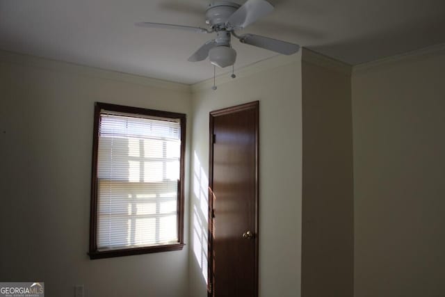 unfurnished bedroom with ceiling fan and crown molding