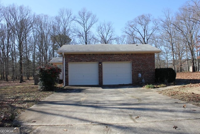 garage featuring driveway