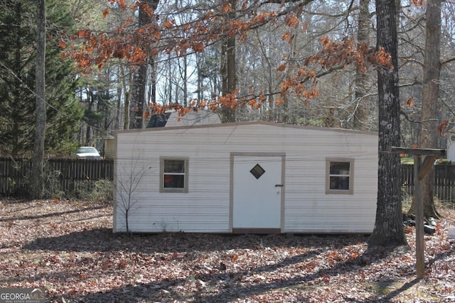 view of shed with fence