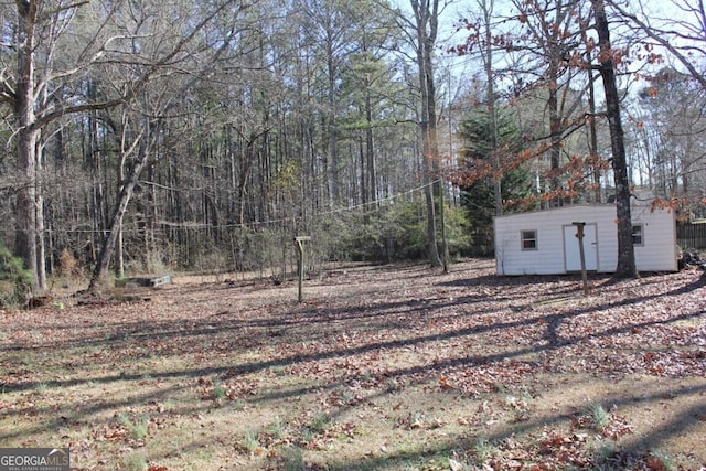 view of yard with a shed and an outdoor structure