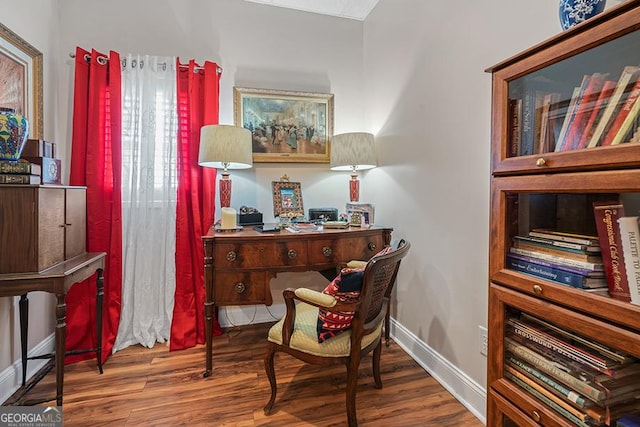 sitting room with hardwood / wood-style floors