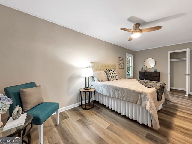 bedroom featuring ceiling fan and hardwood / wood-style flooring