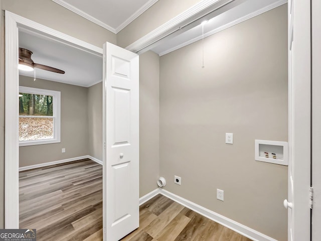 washroom with ceiling fan, crown molding, light hardwood / wood-style flooring, washer hookup, and hookup for an electric dryer