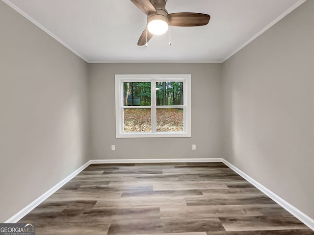 unfurnished room with ceiling fan, wood-type flooring, and crown molding