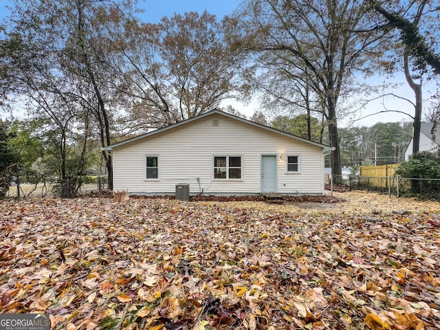 back of property featuring fence